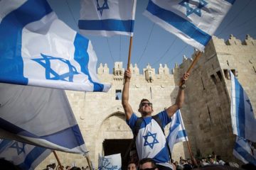 Dancing with Israeli flags at Kotel